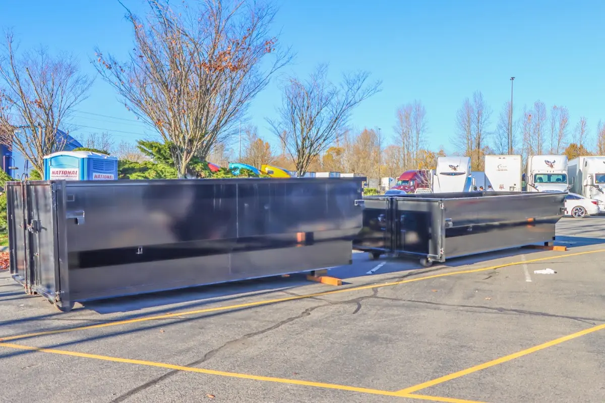 Professional dumpster rental service with roll-off container on residential driveway in Downers Grove